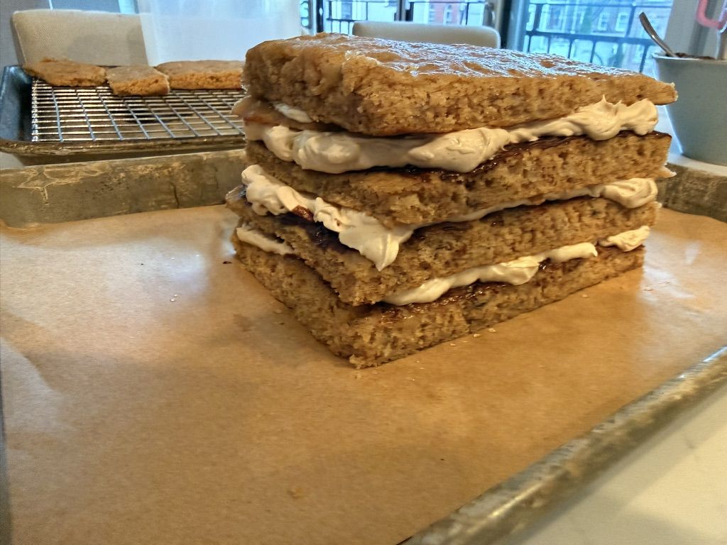 The bars stacked with buttercream and ganache between each layer