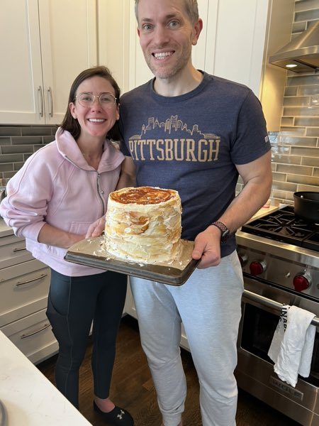 Michael and family holding a finished layer cake