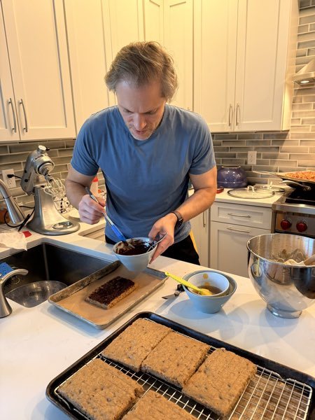 Michael glazing the sticky toffee bars