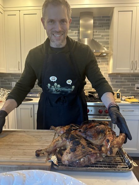 Michael with a whole roasted turkey