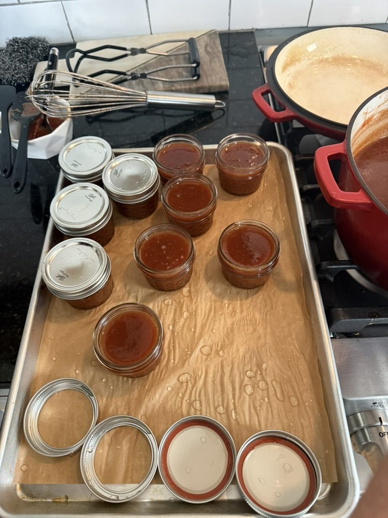Jars being filled on a tray