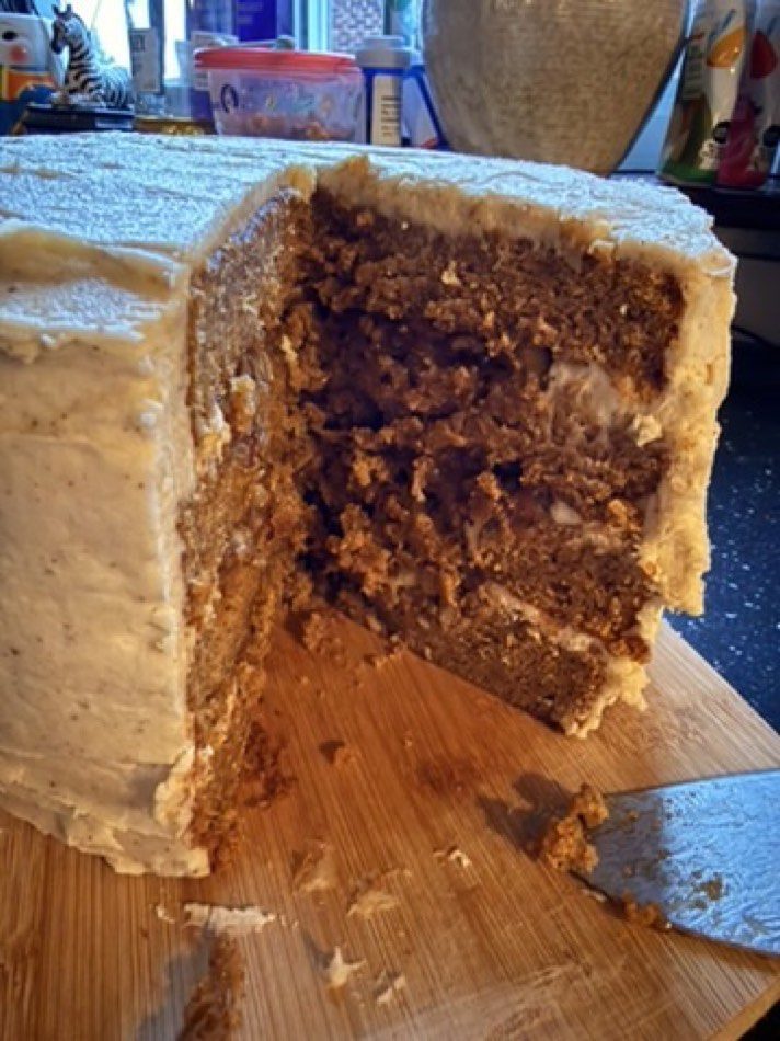 Cross-section of the cake showing four thin layers with pecan goo between