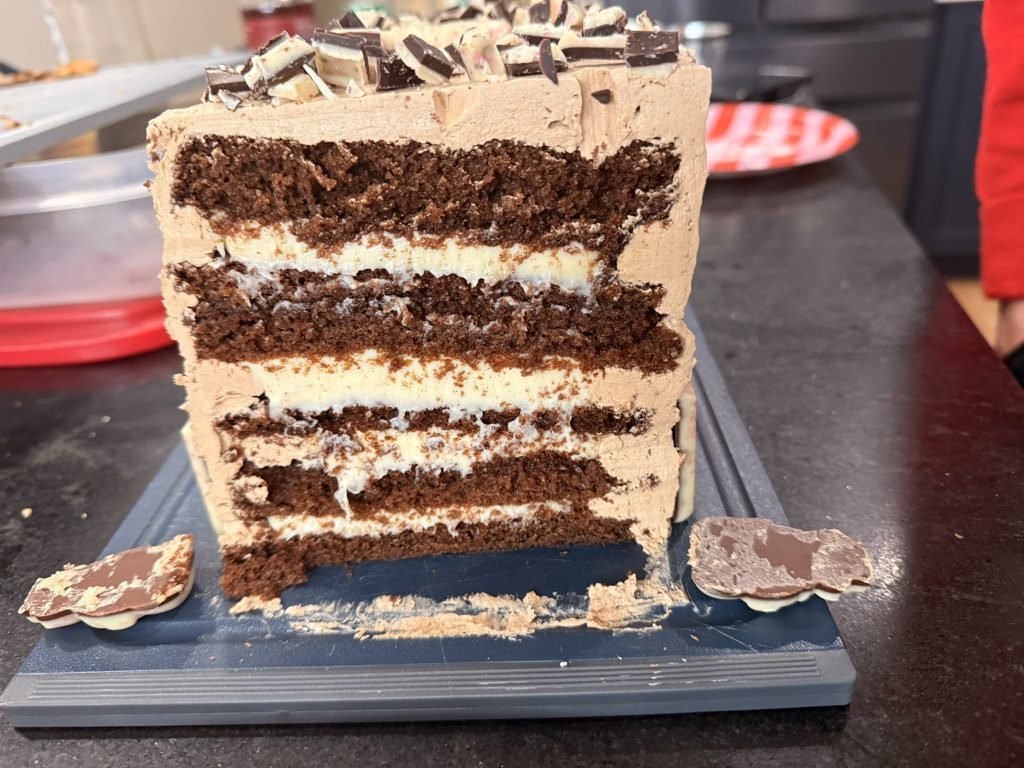 Cross-section of thin mocha layers with white chocolate ganache between