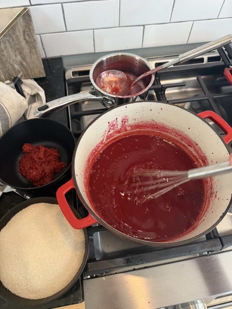 Whisking the jelly in the pot