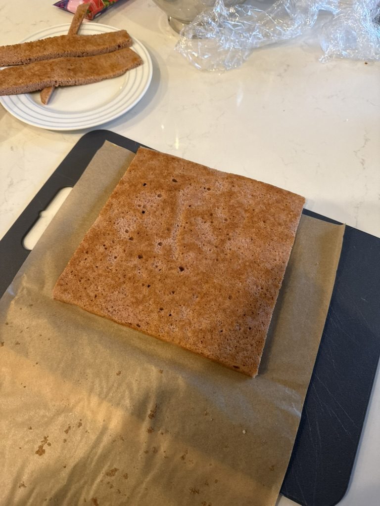 The quarter-sheet baked thin and trimmed