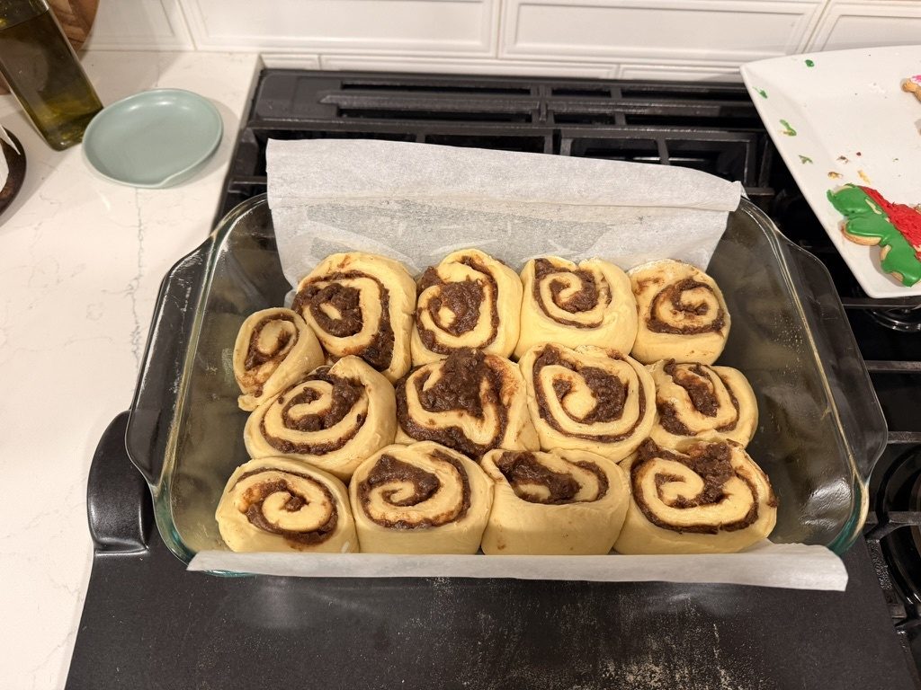 Rolls proofed and touching the morning of the bake